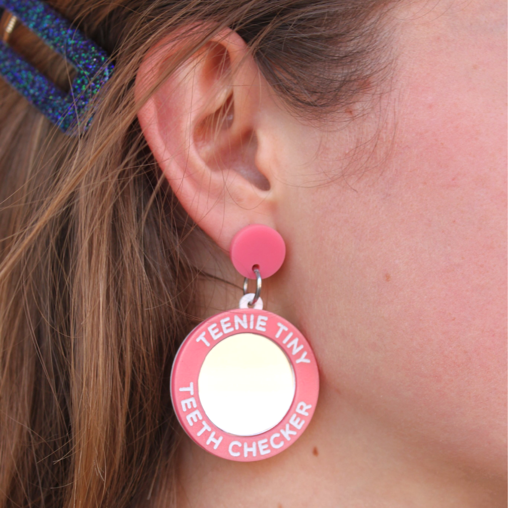 woman wearing things by bean teenie tiny teeth checker earrings in pink - cocoandduckie.com